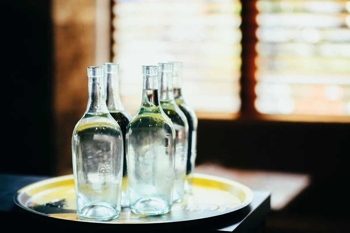 A glass of clear water on a bright surface in soft natural light