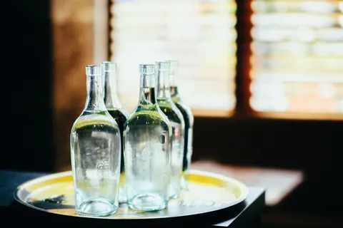A glass of clear water on a bright surface in soft natural light